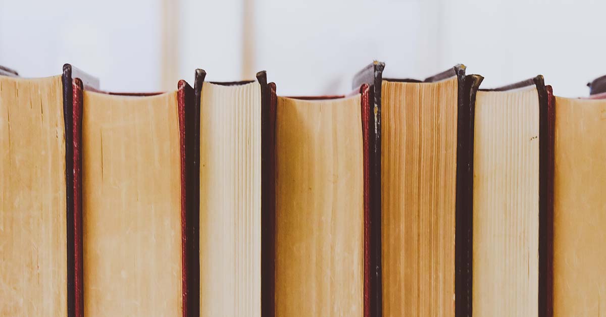 Royalty free stock image of books standing on end by Emily found on Pexels.